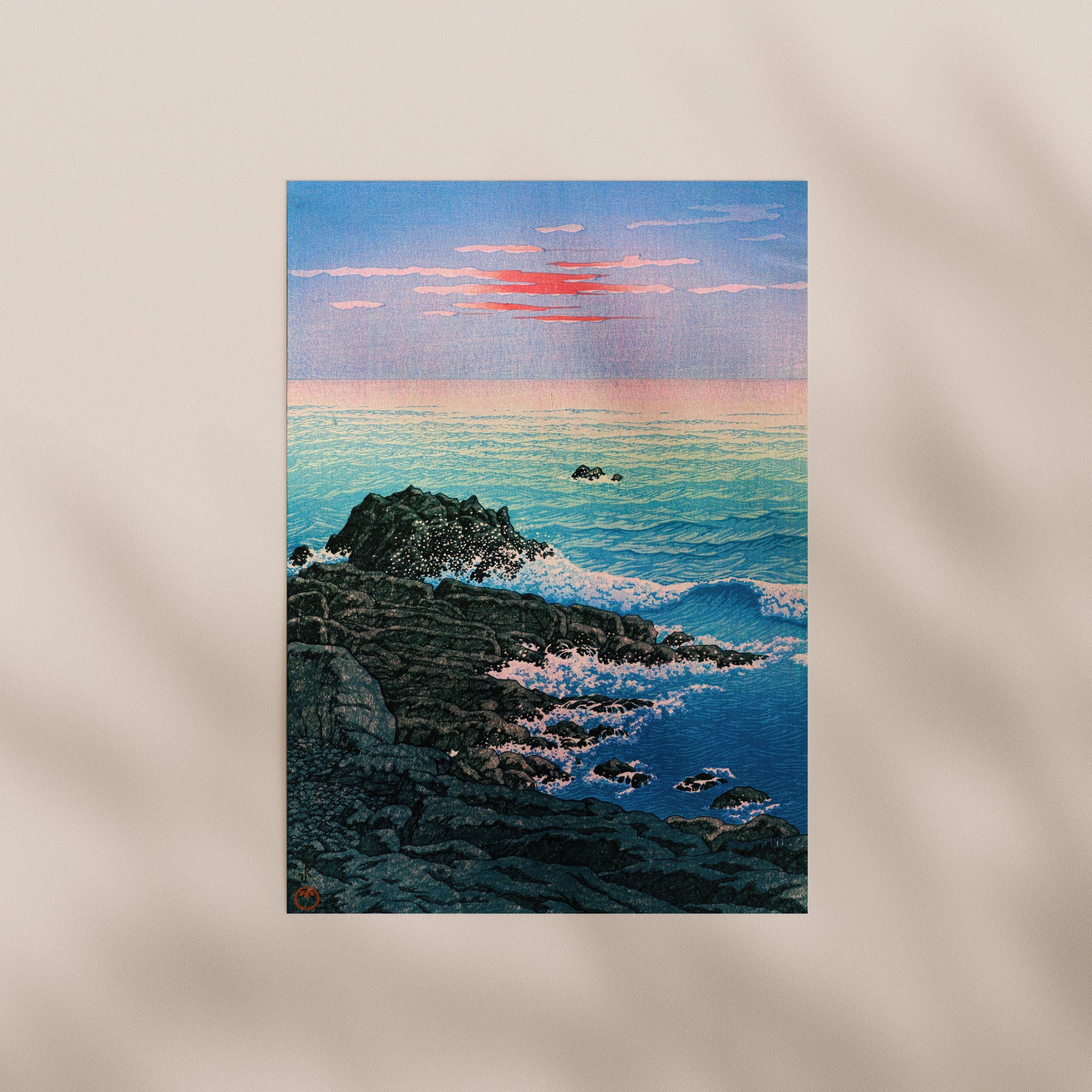 a serene coastal scene with a rocky shoreline, crashing waves, and a vibrant sunset over the ocean.