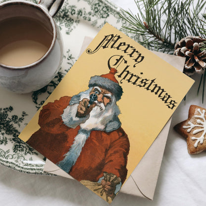 Christmas Greetings Cards: Santa Clause With Gun - Pathos Studio - Greetings Cards