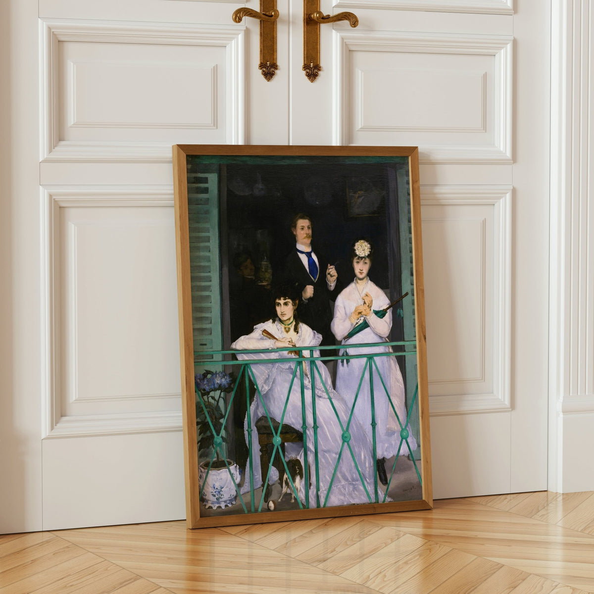 a painting of three elegantly dressed women, with one woman seated on a bench and the other two standing nearby. The painting is framed and displayed on a white door, creating a visually appealing and sophisticated scene.