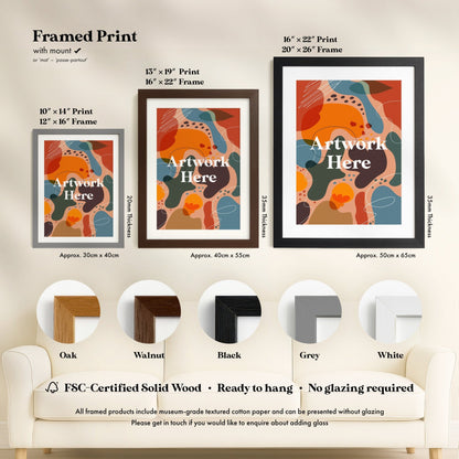 a living room with a white couch and two framed pictures on the wall